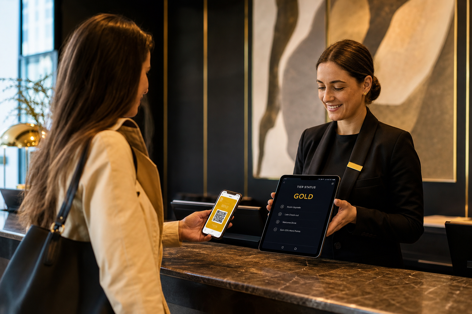 A boutique hotel reception at check-in with a guest holding a phone showing a wallet pass, receptionist glancing at a tablet with tier status visible